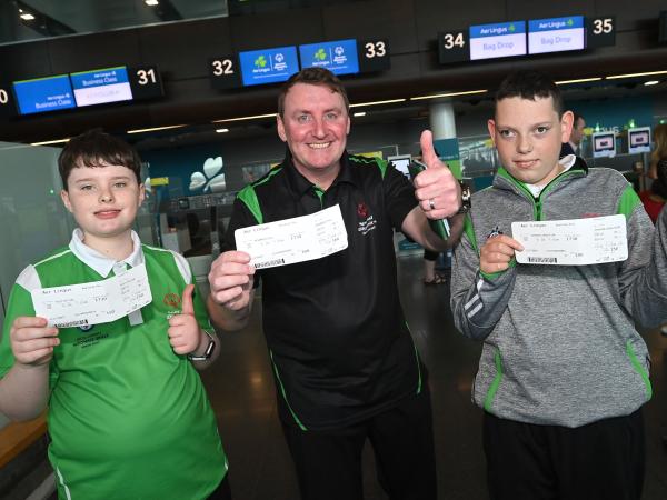 Declan Foley, left, Kian Johnson-Clarke, right, with their coach Cyril McNamara
