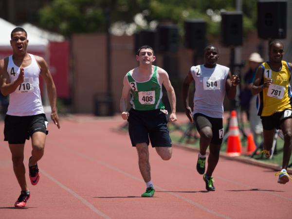 Athletes racing down a track.