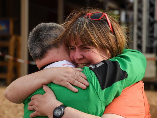 Mother hugging her Special Olympics athlete son