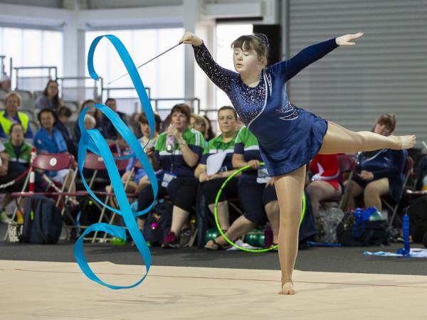 female gymnast with ribbon