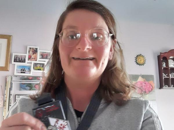 woman shows off medal