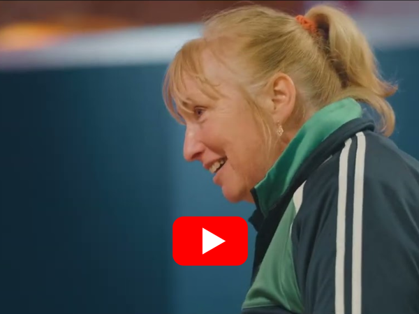 This image shows a women smiling - Bowling - Testimonials.