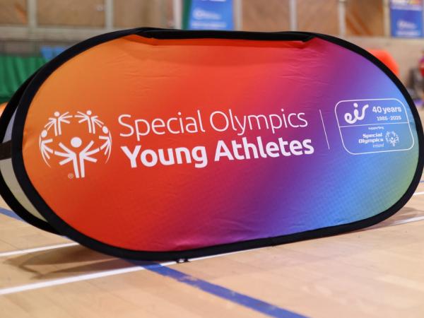 This image shows a colourful banner with the words Young Athletes across it