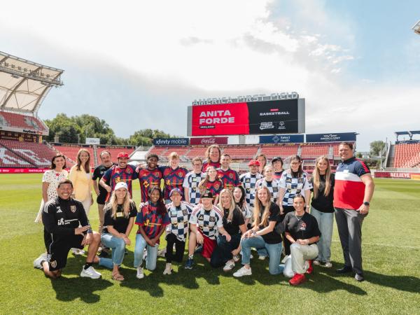 Participants in the Athlete Design Co-Lab event, including Anita Forde, are pictured at a stadium