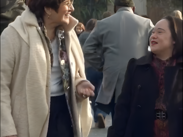 This image shows Mei Lin talking to a women.