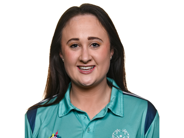 This image shows Kelly Fitzgerald, a volunteer and coach with Special Olympics Ireland. She is wearing her uniform as one of the Assistant Gymnastics Coaches for Team Ireland at the 2023 Special Olympics World Summer Games in Berlin.