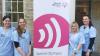 UCC students stand with healthy hearing sign