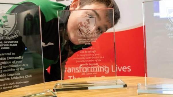 This image shows an Athlete Peeping through Awards - Leeside Legends 20th Anniversary.