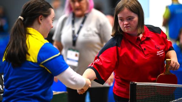 Emma O'Connell of Munster, right, and Clíodhna O'Rourke of Leinster shake hands after competing in the table tennis tournament at the IWA in Dublin during the 2026 Special Olympics Ireland Summer Games