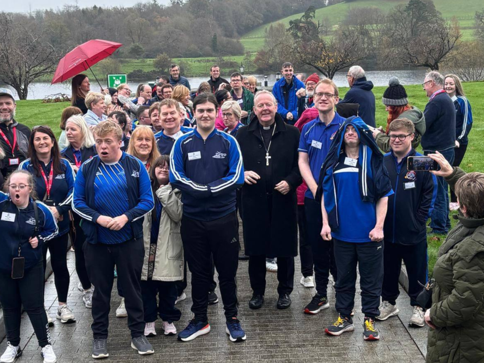 Participants at the Ulster Region Athlete Leadership Forum 2025 enjoying a sing-song while waiting at the fire-alarm gathering point