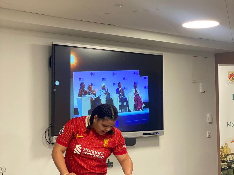 This image shows athlete Moira Scott delivering a presentation about representing Special Olympics Ireland at the World Health Summit in Berlin