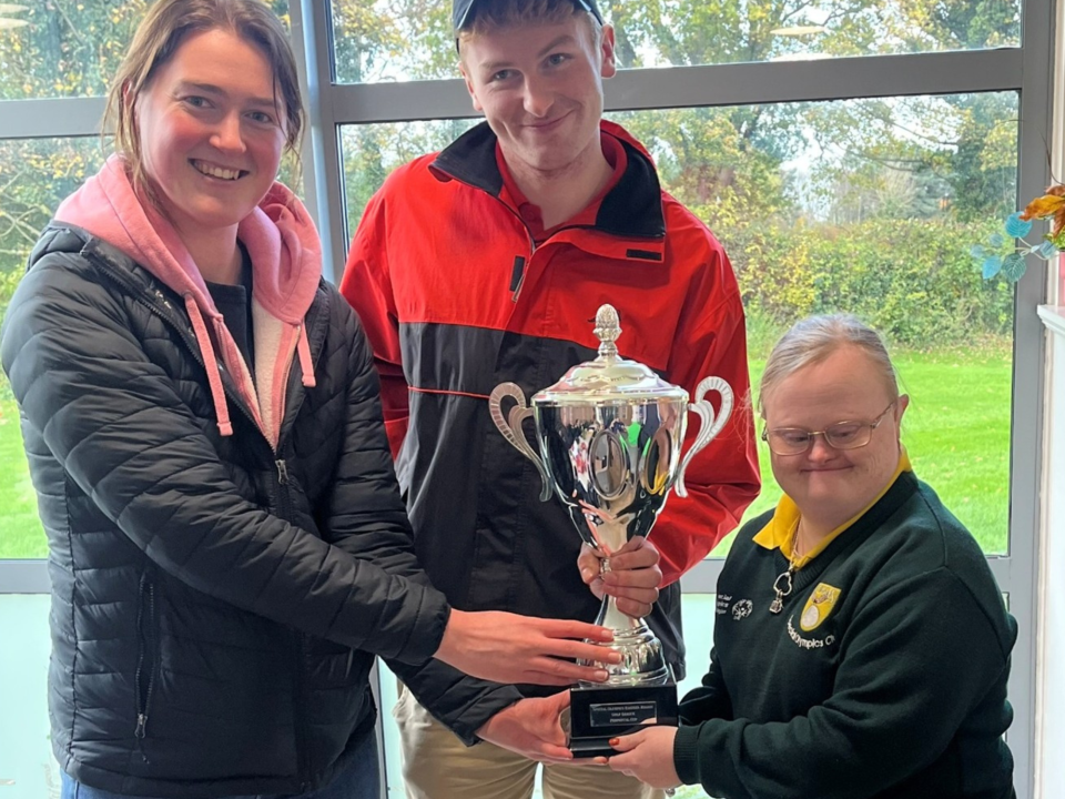 This image shows the captains of Blackrock Flyers and Elm Eagles Clubs sharing the Cup. Left to Right are Ciara Worrell, RDO Sport Eastern Region , Andrew Dunleavy of Blackrock Flyers, Alison Kelly of Elm Eagles.png