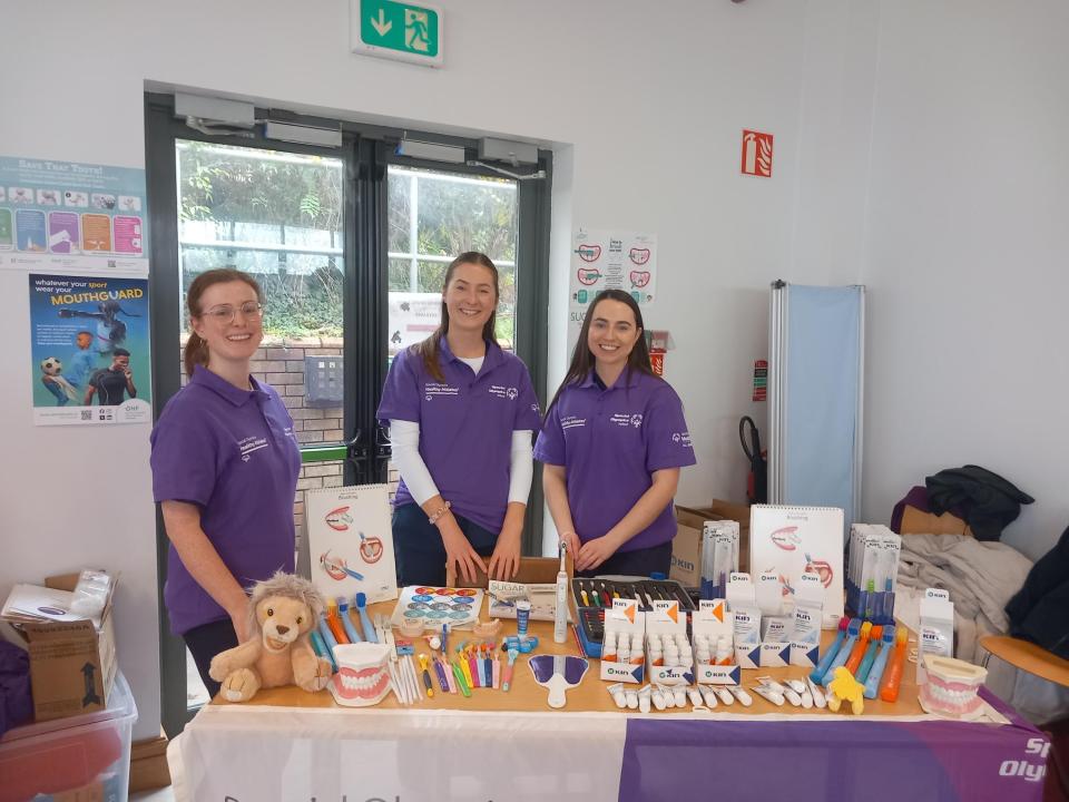 This image features dental students performing dental health checks for the Healthy Athletes Special Smiles programme at UCC