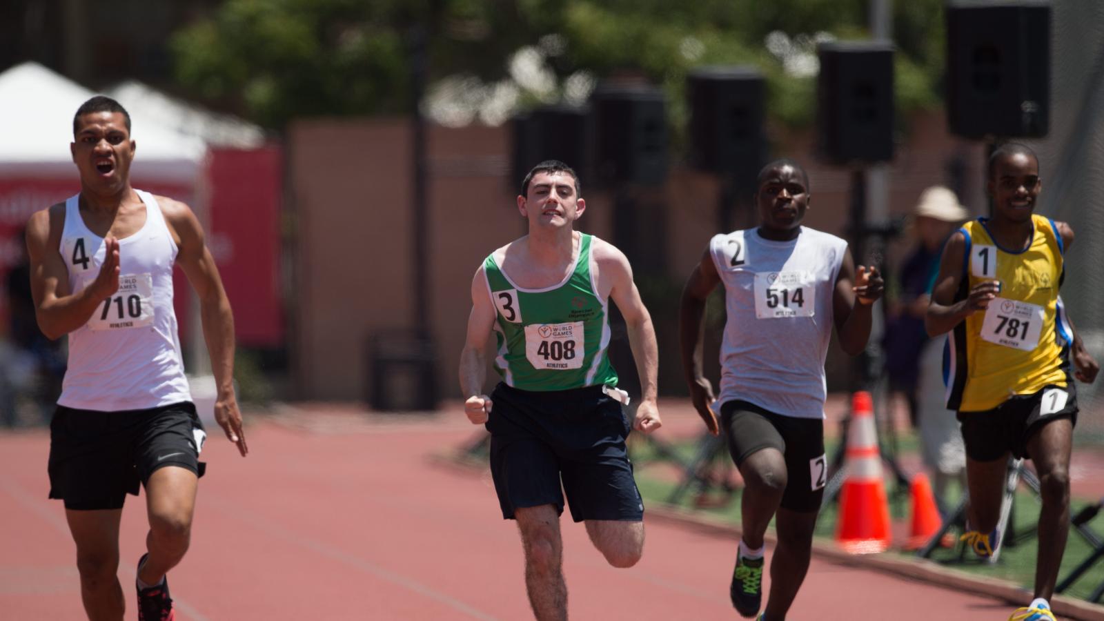 Athletes racing down a track.