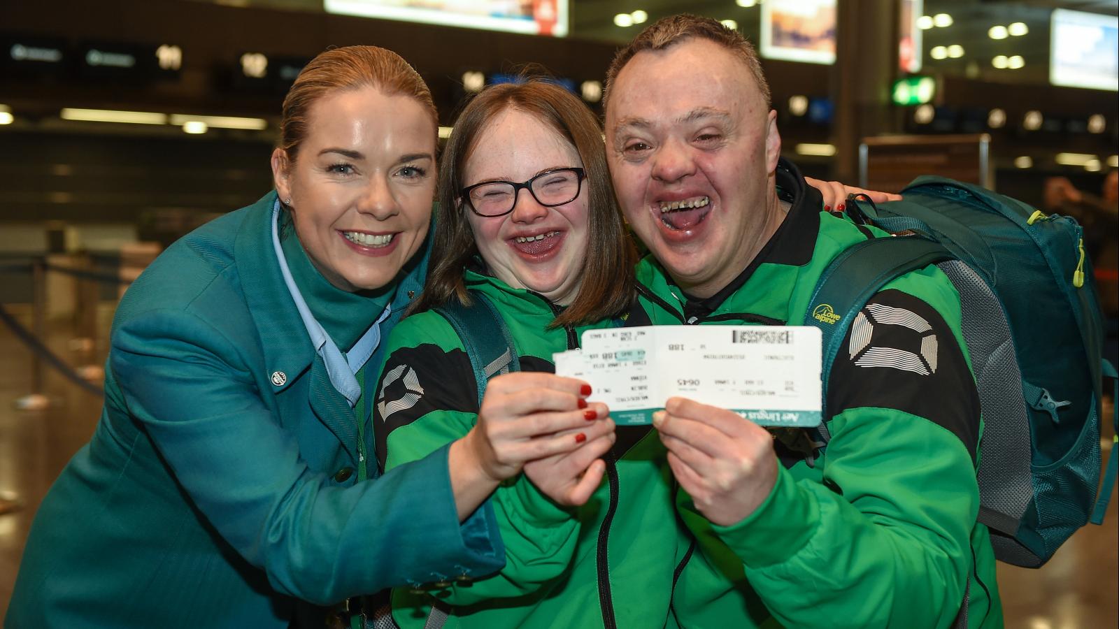 Aer Lingus air hostess and two special olympics athletes at the airport