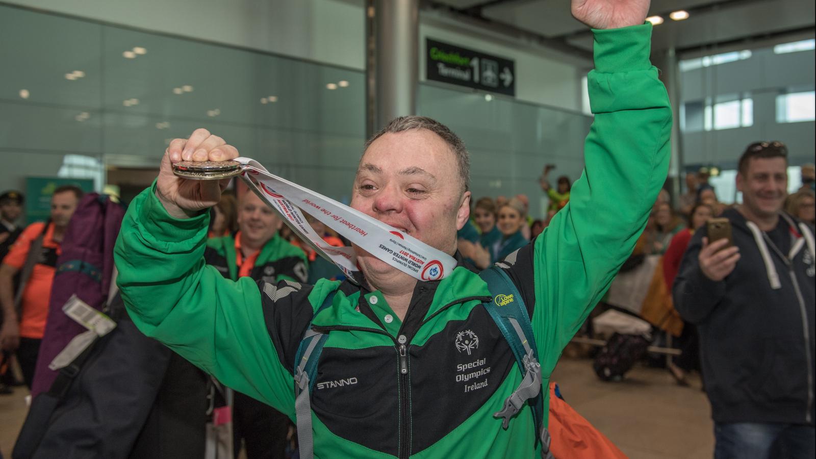 Cyril Walker returning home with his medal at Dublin Airport