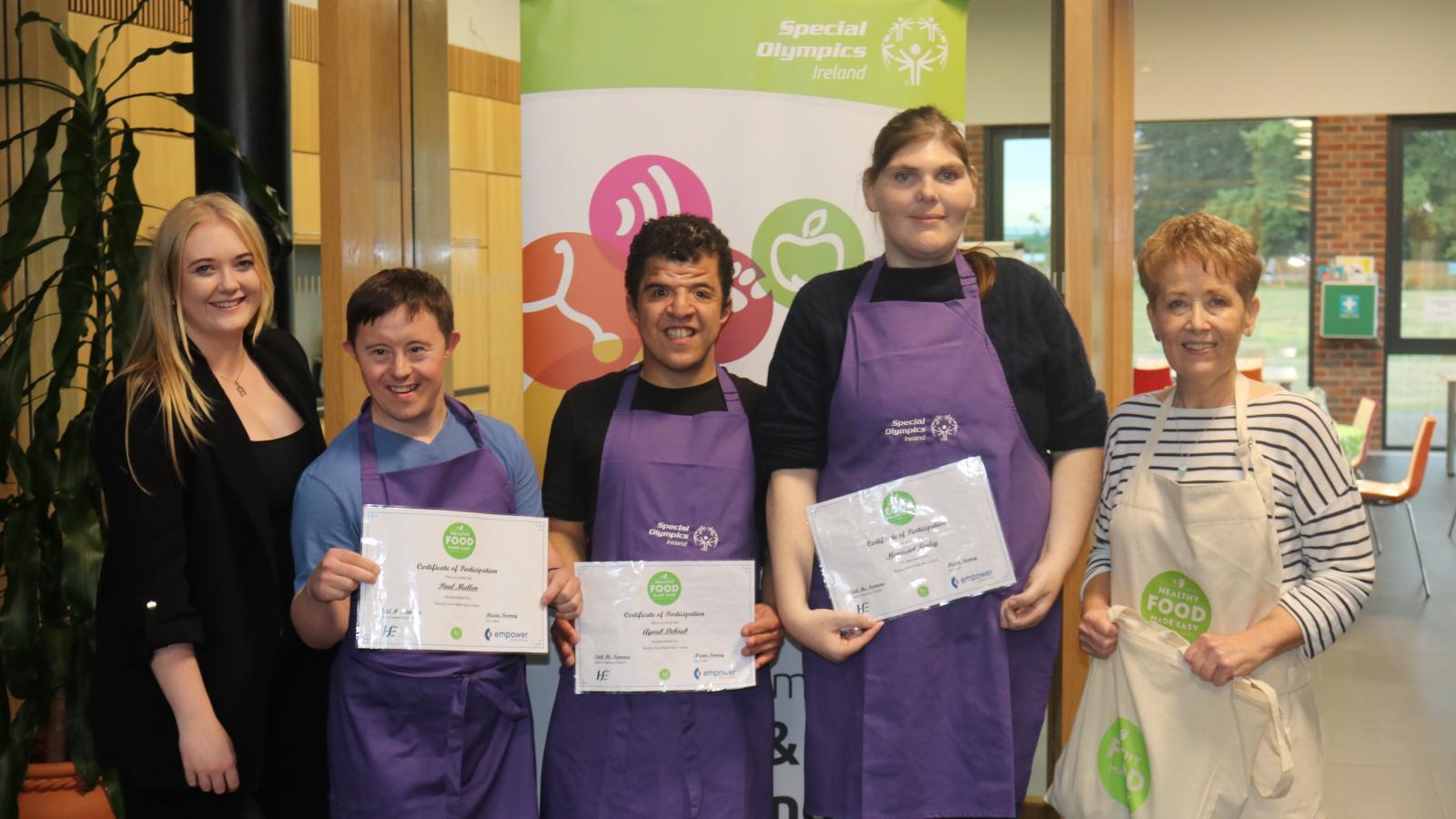 Athletes stand with certificate for healthy food made easy workshop