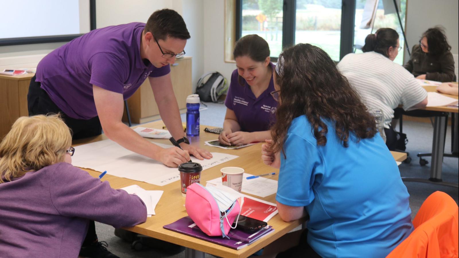 People work on group project for Health messenger training