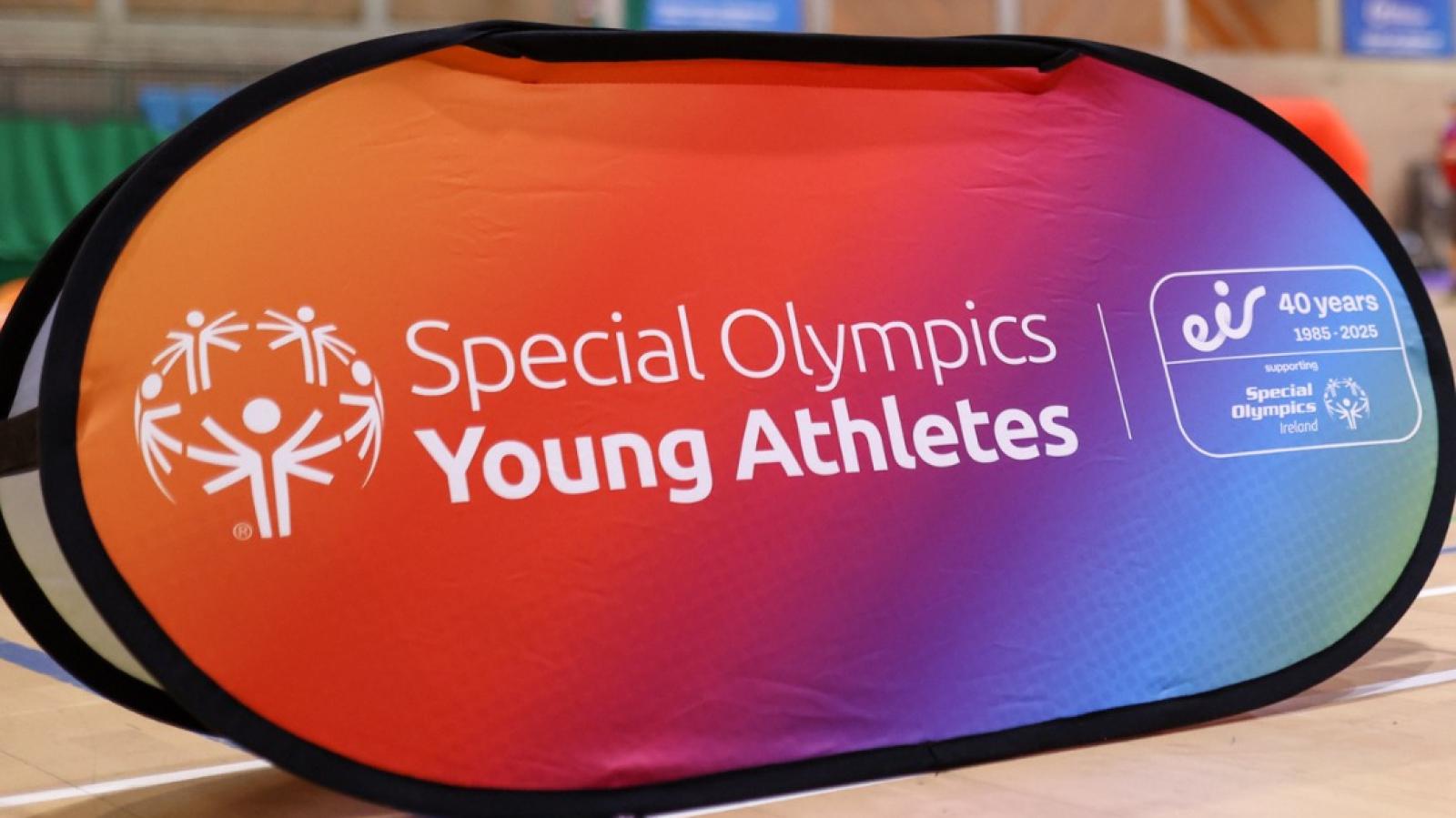 This image shows a colourful banner with the words Young Athletes across it