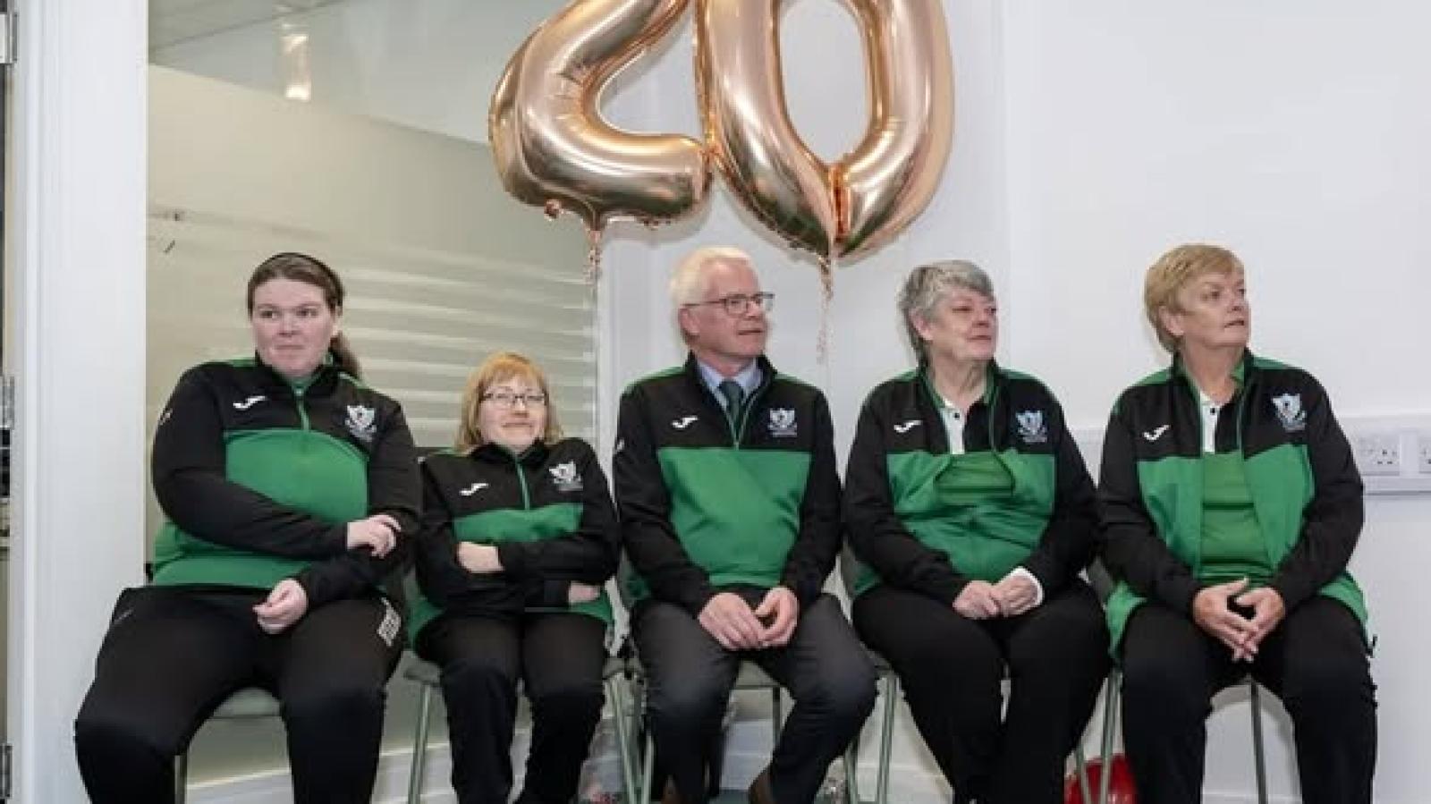 This image shows a group Photo - Leeside Legends, in Cork - 20th Anniversary with balloon